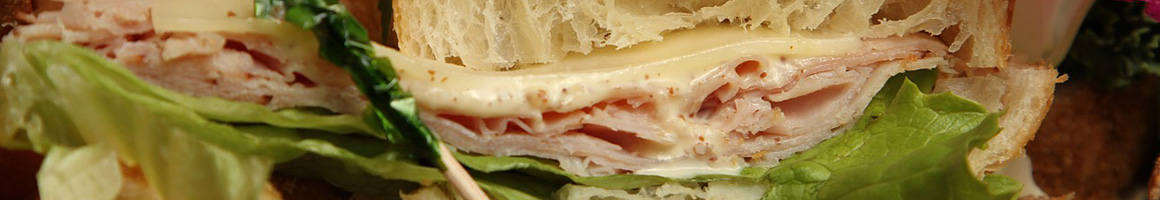 Eating Deli Sandwich at El Cajon Pass Deli restaurant in El Cajon, CA.